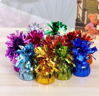 Coloured balloon weights for holding helium balloon bouquets and table centres